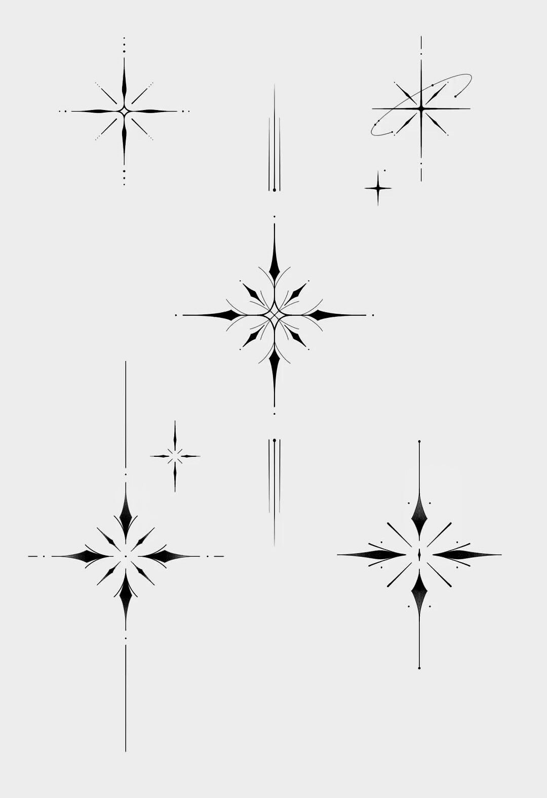 Flash sheet of six ornamental star and sparkle designs in black ink on a pale grey ground, ranging from a simple four-point spark to a dense layered starburst.
